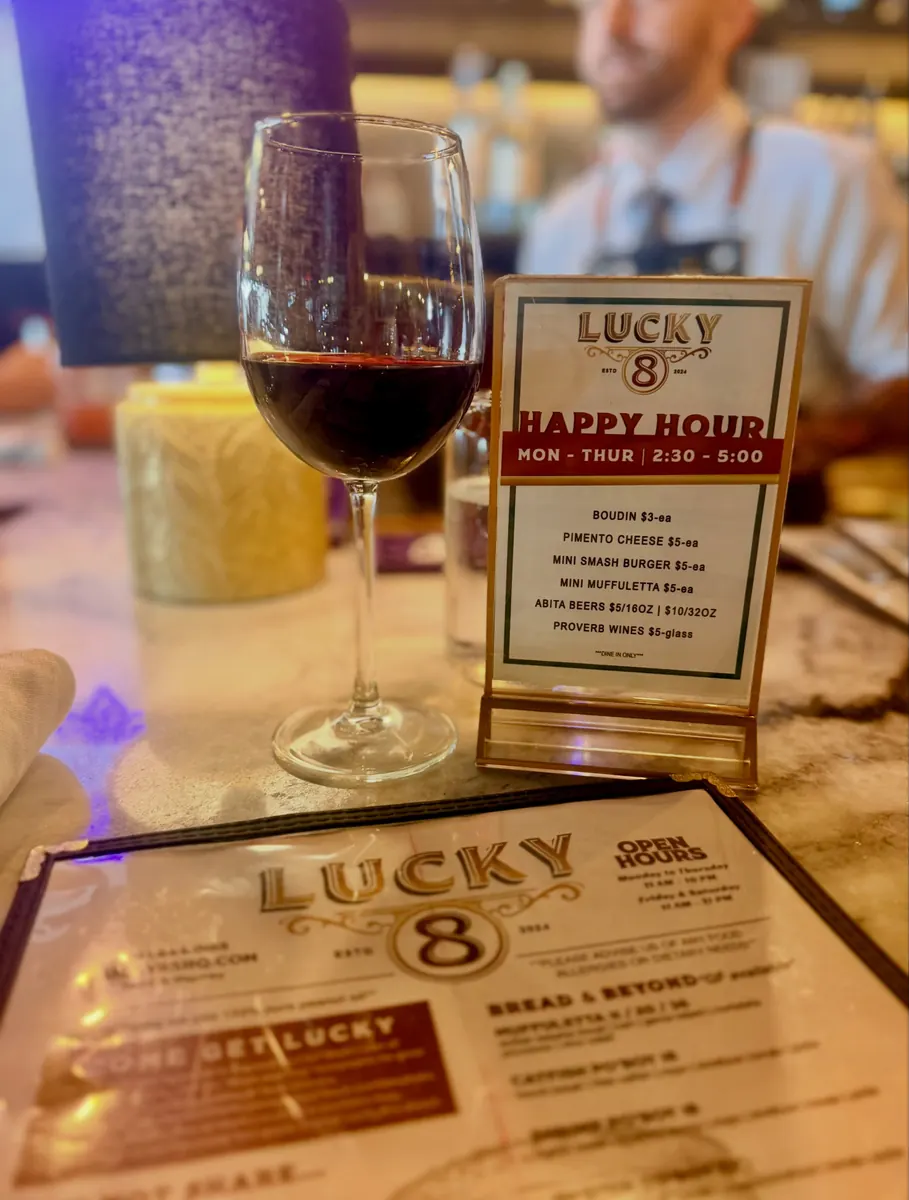 Red wine and Happy Hour sign at Lucky 8